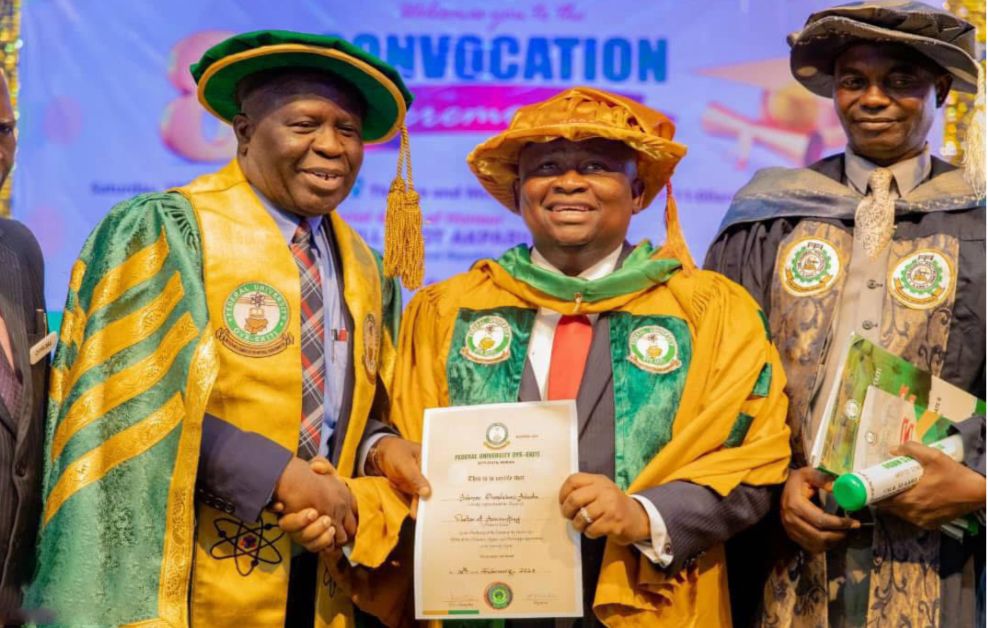 Senator Adeola receives an Honorary Doctorate in Accounting from FUOYE, Ekiti State, flanked by Gov. Biodun Oyebanji of Ekiti State, Senate Leader Opeyemi Bamidele, and VC Prof. Abayomi Fasina.